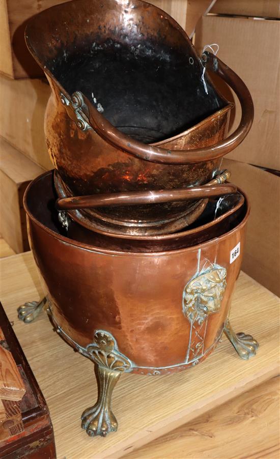 Two hammered copper coal helmets and a brass mounted copper log bowl
